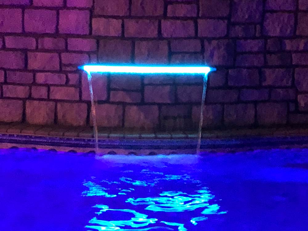 Vinyl pool with waterfall, light, night
